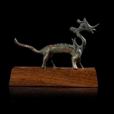 Lot 24 - A small Chinese gilt-bronze figure of a striding dragon 铜鎏金行龙