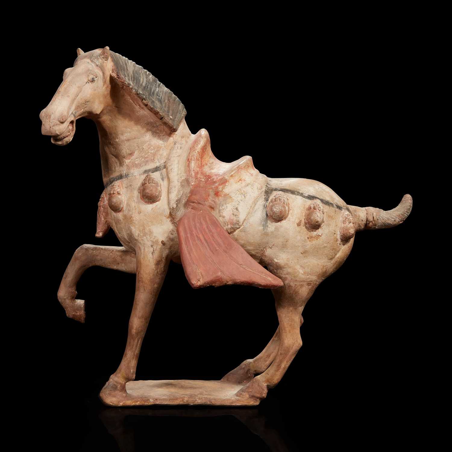 Lot 92 - A Chinese painted pottery figure of a prancing horse