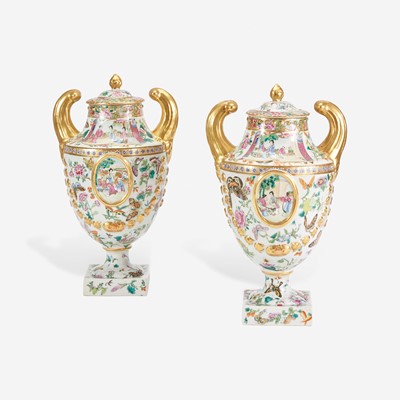 Lot 116 - A Pair of Chinese Export Porcelain Famille Rose Pistol-Handled Urns and Covers