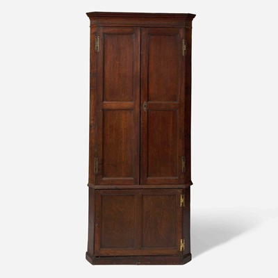 Lot 13 - A George III carved oak corner cupboard