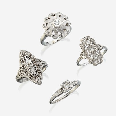 Lot 139 - A collection of four white gold and diamond rings