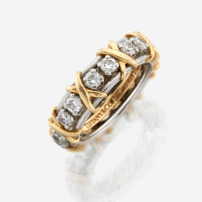 Lot 185 - A gold, platinum, and diamond band, Tiffany & Co.