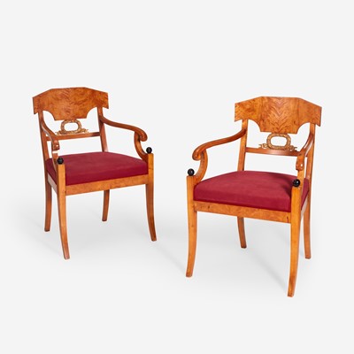 Lot 131 - A Pair of Swedish Neoclassical Birchwood Ebonized and Parcel Gilt Armchairs