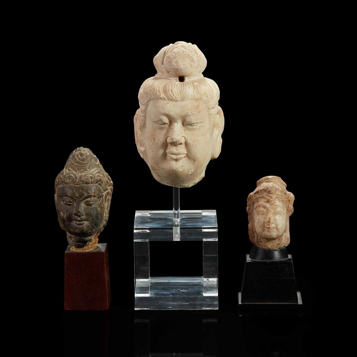 Lot 96 - Three Chinese carved stone small heads