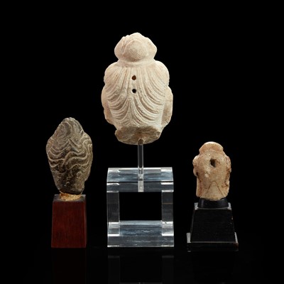 Lot 96 - Three Chinese carved stone small heads