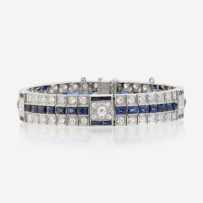 Lot 42 - An Art Deco diamond, synthetic sapphire, and white gold bracelet