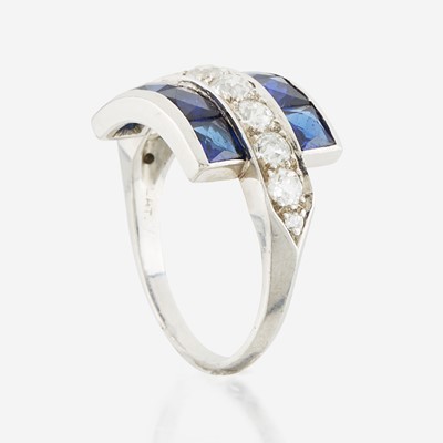 Lot 22 - A diamond, blue glass, and platinum ring