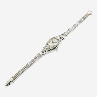 Lot 136 - A lady's platinum and white gold diamond bracelet watch, Hamilton