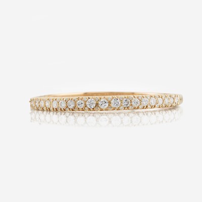 Lot 6 - A gold and diamond bangle bracelet