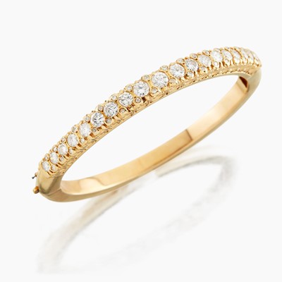 Lot 6 - A gold and diamond bangle bracelet
