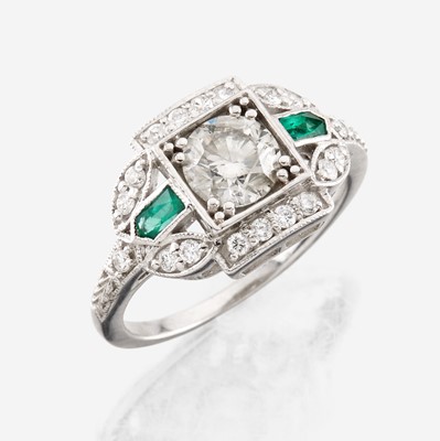 Lot 38 - A diamond, emerald, and white gold ring
