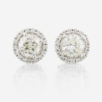 Lot 133 - A pair of diamond and white gold earrings