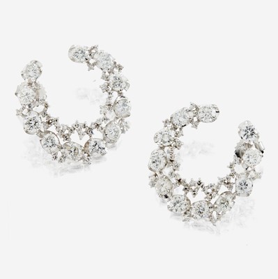 Lot 142 - A pair of diamond and white gold earrings