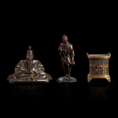 Lot 228 - Two small Japanese patinated figures and a parcel-gilt metal miniature cabinet, Komai