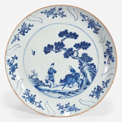 Lot 57 - A Chinese export molded blue and white porcelain "Meiren, Boy and Buffalo" large dish