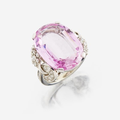 Lot 9 - An 18K white gold, pink topaz, and diamond ring