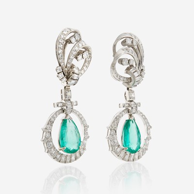 Lot 32 - A pair of emerald, diamond, and platinum pendant ear clips, Mauboussin
