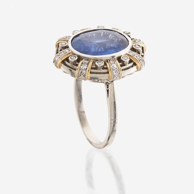 Lot 46 - A sapphire, diamond, gold, and platinum ring