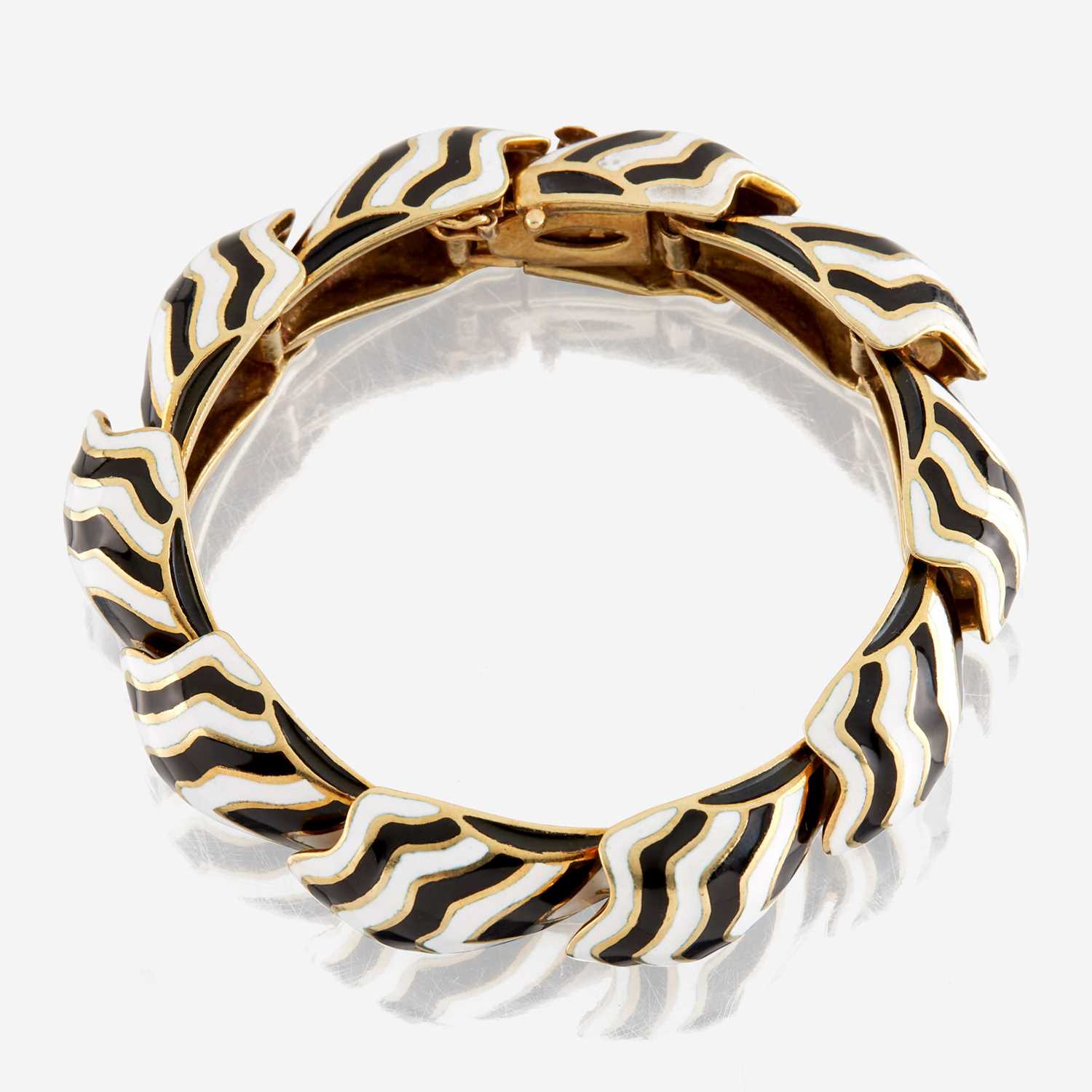 Lot 75 - A gold and enamel bracelet