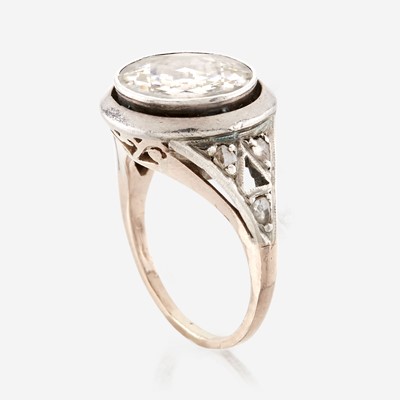 Lot 3 - A diamond, sterling silver, and gold ring