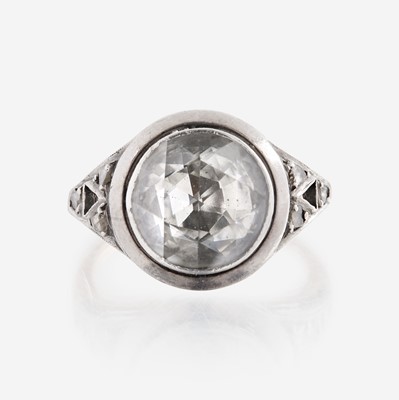Lot 3 - A diamond, sterling silver, and gold ring