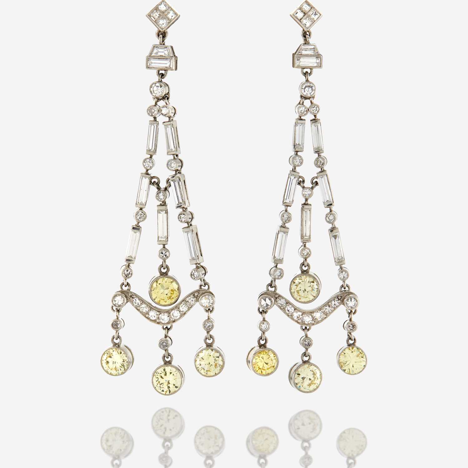 Lot 27 - A pair of diamond, colored diamond, and platinum pendant earrings