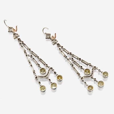 Lot 27 - A pair of diamond, colored diamond, and platinum pendant earrings