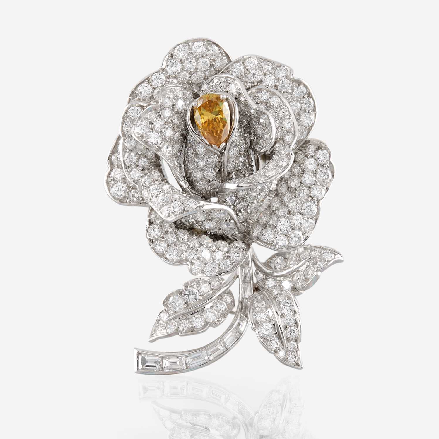 Lot 73 - A diamond, yellow diamond, and platinum rose brooch