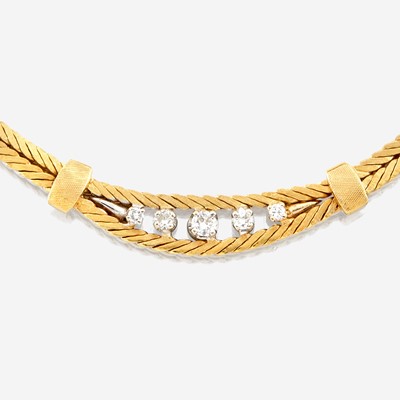 Lot 87 - A gold and diamond necklace with matching bracelet