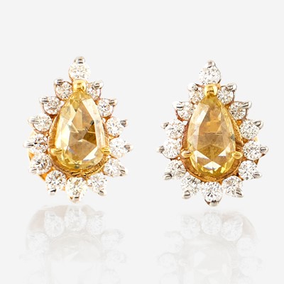Lot 119 - A pair of colored diamond, diamond, and gold earrings