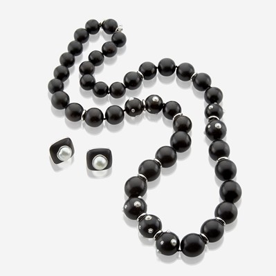 Lot 73 - A white gold, ebony, diamond, and pearl necklace with matching earrings