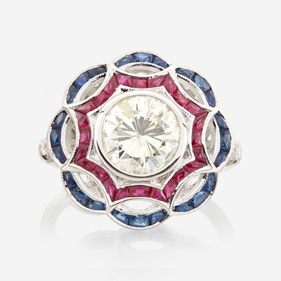 Lot 43 - A diamond, ruby, sapphire, and white gold ring