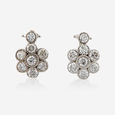 Lot 153 - A pair of diamond and white gold earrings