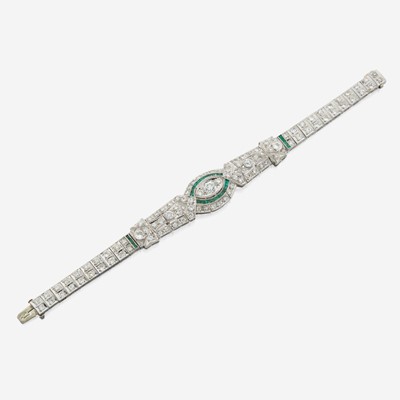 Lot 33 - An Art Deco emerald, diamond, and platinum bracelet