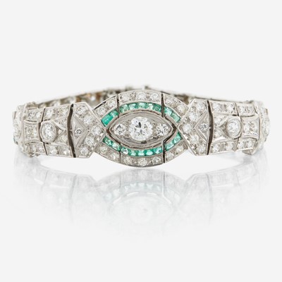 Lot 33 - An Art Deco emerald, diamond, and platinum bracelet