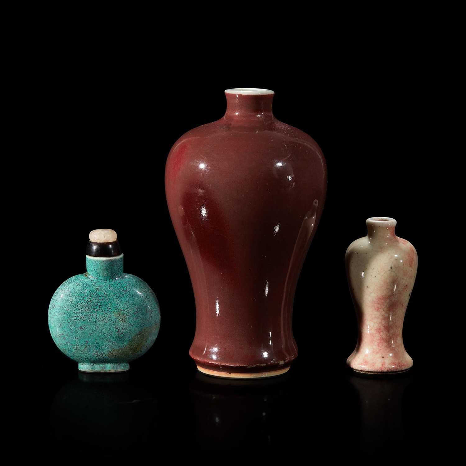 Lot 164 - A Chinese red-glazed small meiping and two porcelain snuff bottles