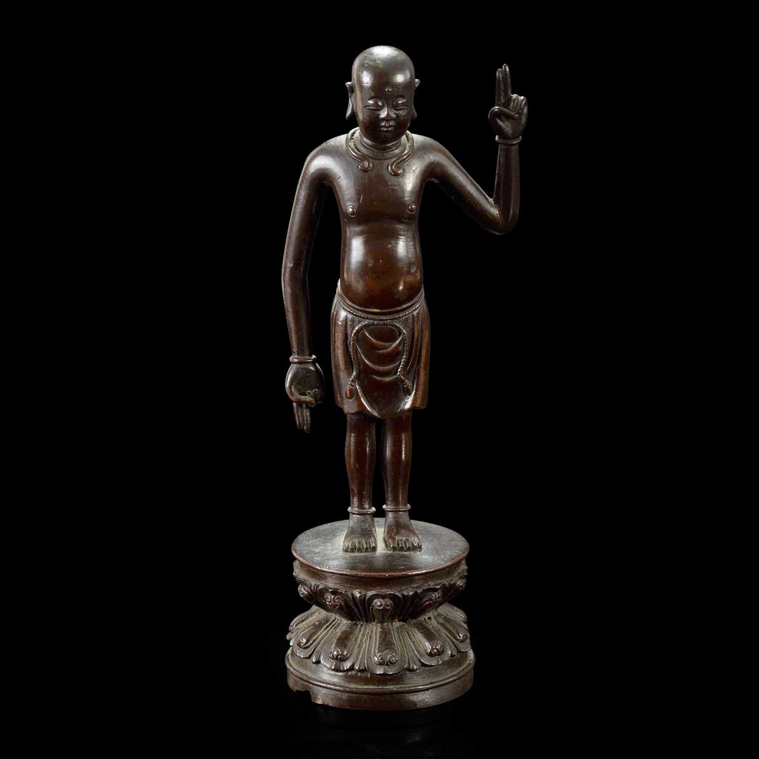 Lot 123 - A Chinese bronze figure of the infant Buddha