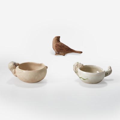 Lot 22 - A Vietnamese small figure of a bird and two small "Parrot and Peach" cups