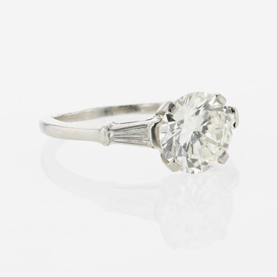Lot 85 - A diamond accented solitaire ring