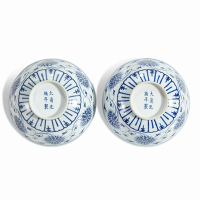 Lot 83 - An associated pair of Chinese blue and white porcelain "Lotus" bowls