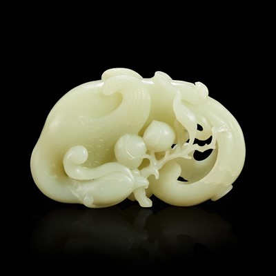 Lot 160 - A Chinese carved white jade "Phoenix and Peach" large ornament