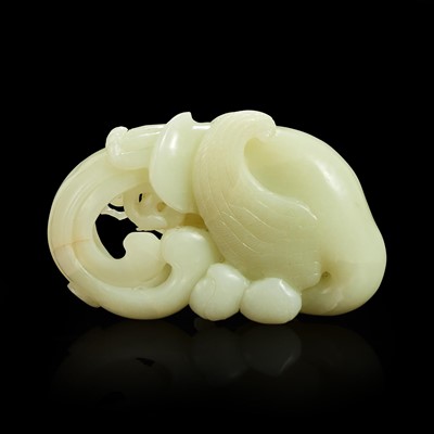 Lot 160 - A Chinese carved white jade "Phoenix and Peach" large ornament
