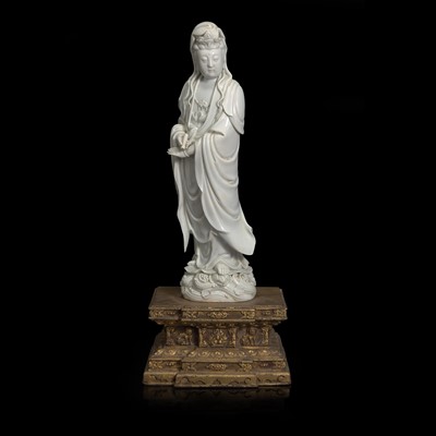 Lot 52 - A Chinese blanc de Chine figure of Guanyin, with Japanese gilt-lacquered stand 白瓷观音像及日本底座