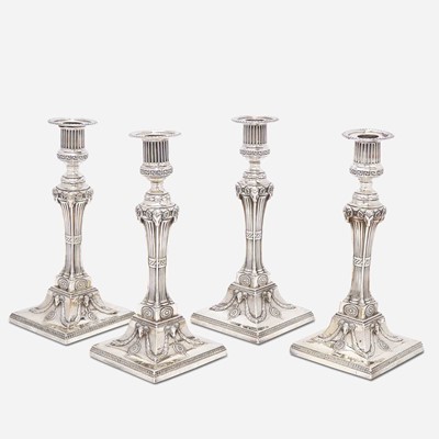 Lot 17 - A set of four George III sterling silver weighted candlesticks