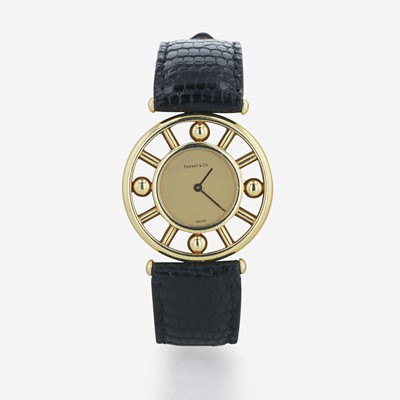 Lot 112 - A lady's 18K gold and leather strap wristwatch, Tiffany & Co.