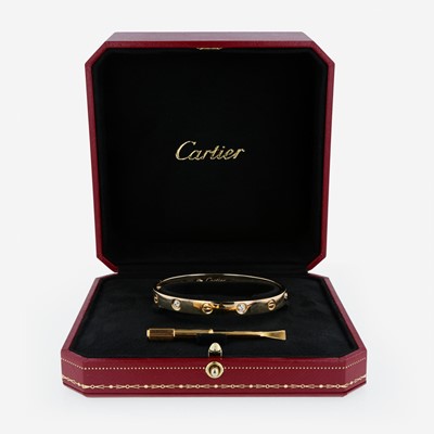 Lot 56 - An 18K yellow gold and diamond bracelet, Cartier