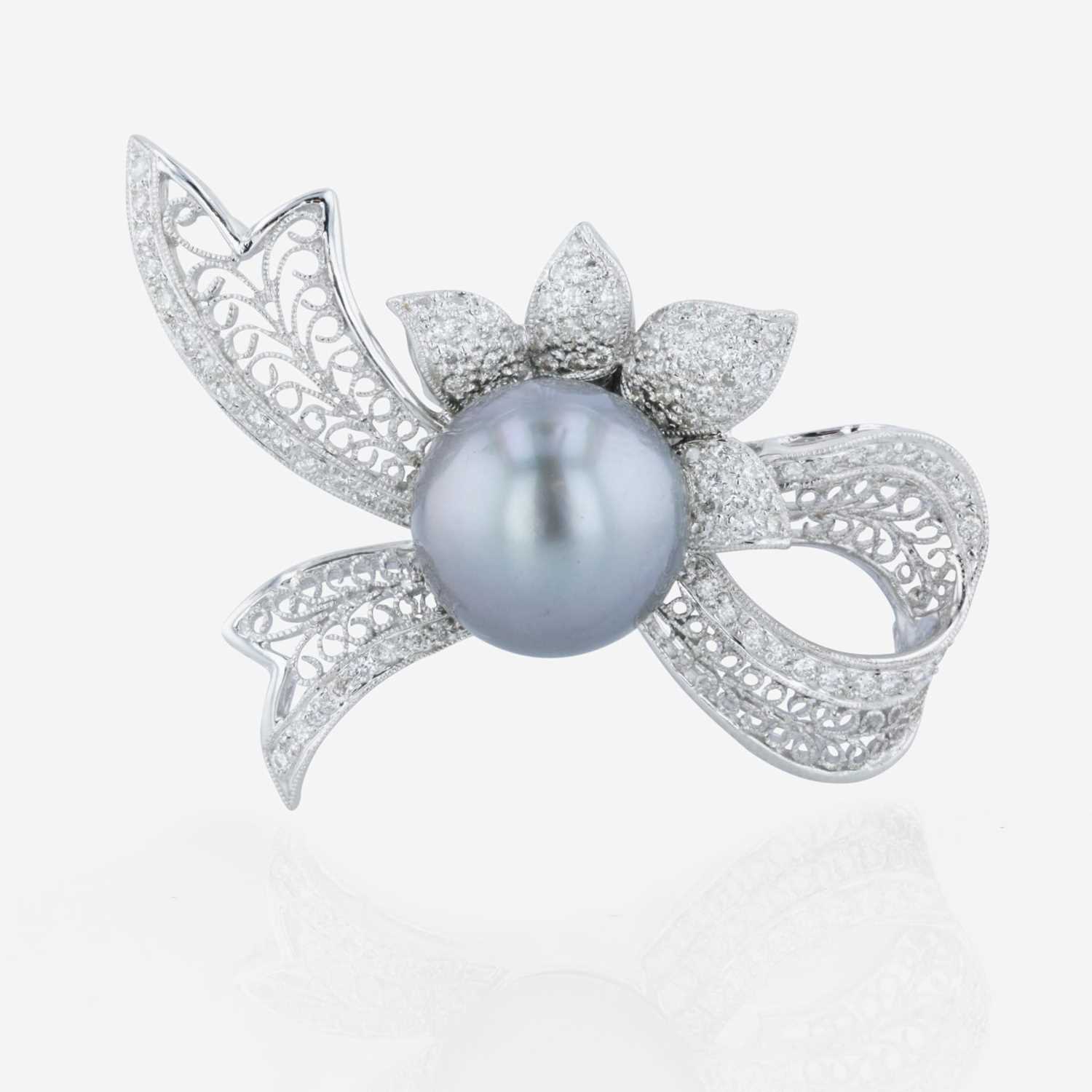 Lot 90 - An 18K white gold, Tahitian cultured pearl, and diamond brooch