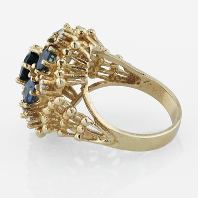Lot 21 - A 14K yellow gold, sapphire, and diamond ring