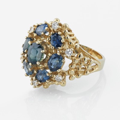 Lot 21 - A 14K yellow gold, sapphire, and diamond ring