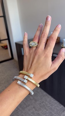 Lot 28 - An 18K white gold and diamond cuff bracelet